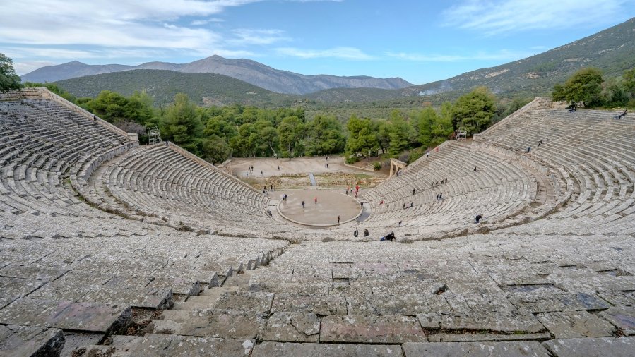 tthe Ancient Theatre of Epidaurus. Known for its incredible acoustics and scenic surroundings, this UNESCO World Heritage site