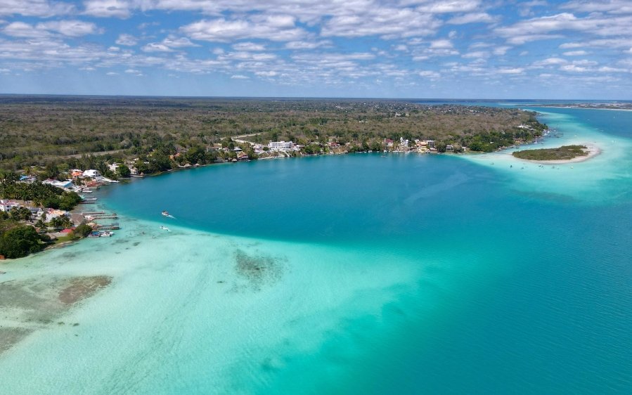Located in Quintana Roo, Mexico, Bacalar Lagoon is a stunning freshwater paradise that’s often called the “Lagoon of Seven Colors” because of its vibrant, crystal-clear waters