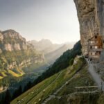 Located into a cliffside in the Swiss canton of Appenzell Innerrhoden, Berggasthaus Aescher-Wildkirchli is one of the most iconic and jaw-dropping guesthouses in the world.