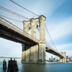 The Brooklyn Bridge’s story is as epic as the city it connects. Back in the mid-19th century, Manhattan and Brooklyn were separate cities
