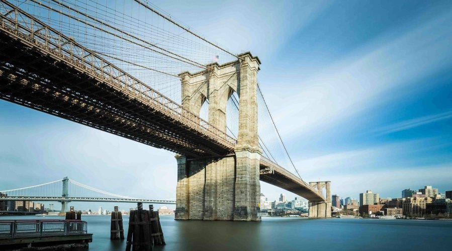 The Brooklyn Bridge’s story is as epic as the city it connects. Back in the mid-19th century, Manhattan and Brooklyn were separate cities