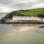 Cushendun located along the rugged coastline of Northern Ireland’s Causeway Coast, a picture-perfect village with an undeniable charm.