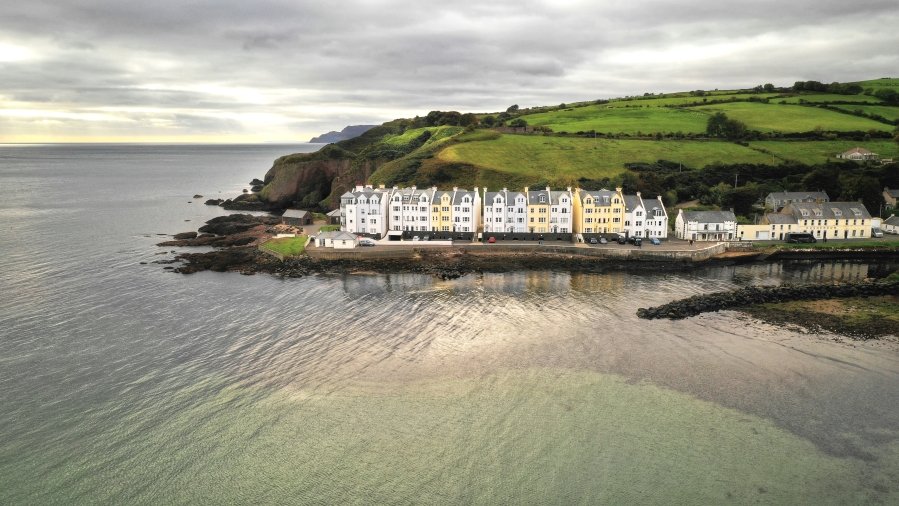Cushendun located along the rugged coastline of Northern Ireland’s Causeway Coast, a picture-perfect village with an undeniable charm.