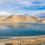 Located high in the Pamir Mountains, Karakul Lake in Xinjiang, China, is an awe-inspiring destination that feels like something out of a dream.