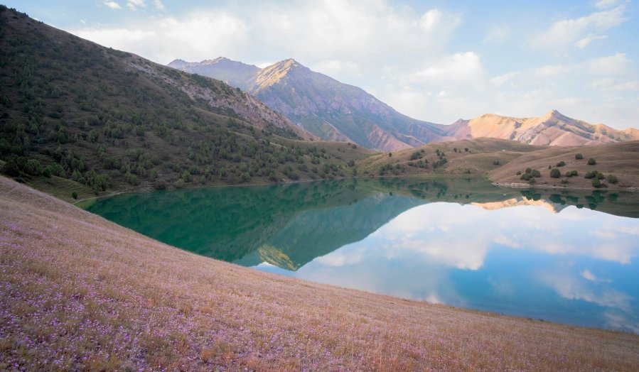 Placed away in the stunning Allay Valley of Osh Province, Kolduk Lake is a lesser-known treasure of Kyrgyzstan. Surrounded by towering mountains
