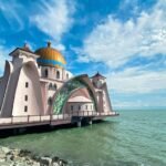 Malacca Straits Mosque, located on the shores of Malacca City in Malaysia. This iconic mosque is more than just a place of worship, it's a symbol of serenity and architectural beauty.