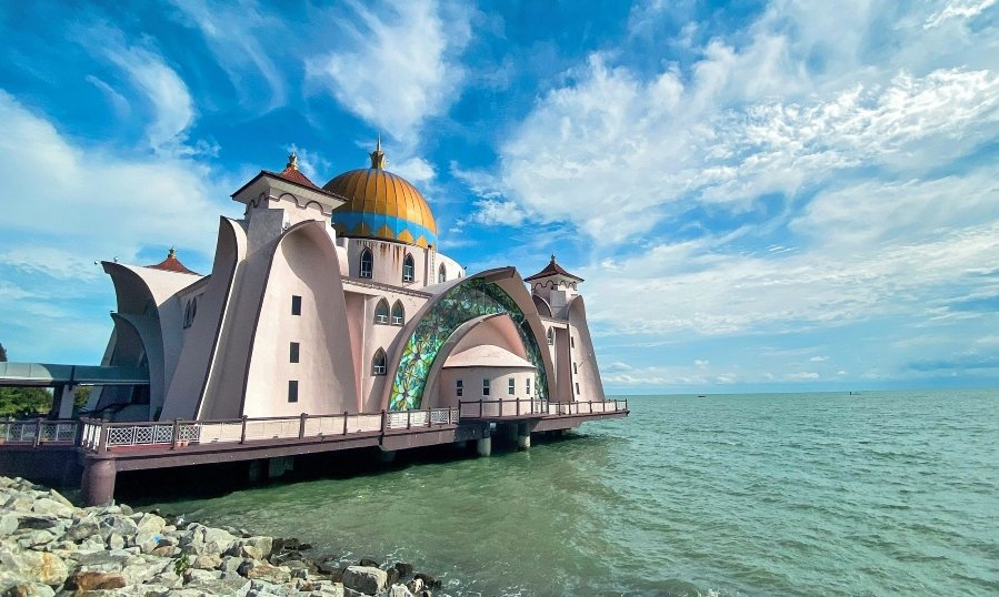Malacca Straits Mosque, located on the shores of Malacca City in Malaysia. This iconic mosque is more than just a place of worship, it's a symbol of serenity and architectural beauty.
