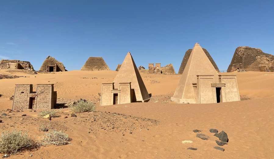 The pyramids of Meroë are the burial sites of royal Kushite figures, filled with treasures and intricately carved inscriptions, although many were looted during colonial times.