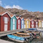 the picturesque town of Smögen is famous for its colorful boathouses that line the waterfront. These vibrant, charming structures add a burst of life to the rocky coastline