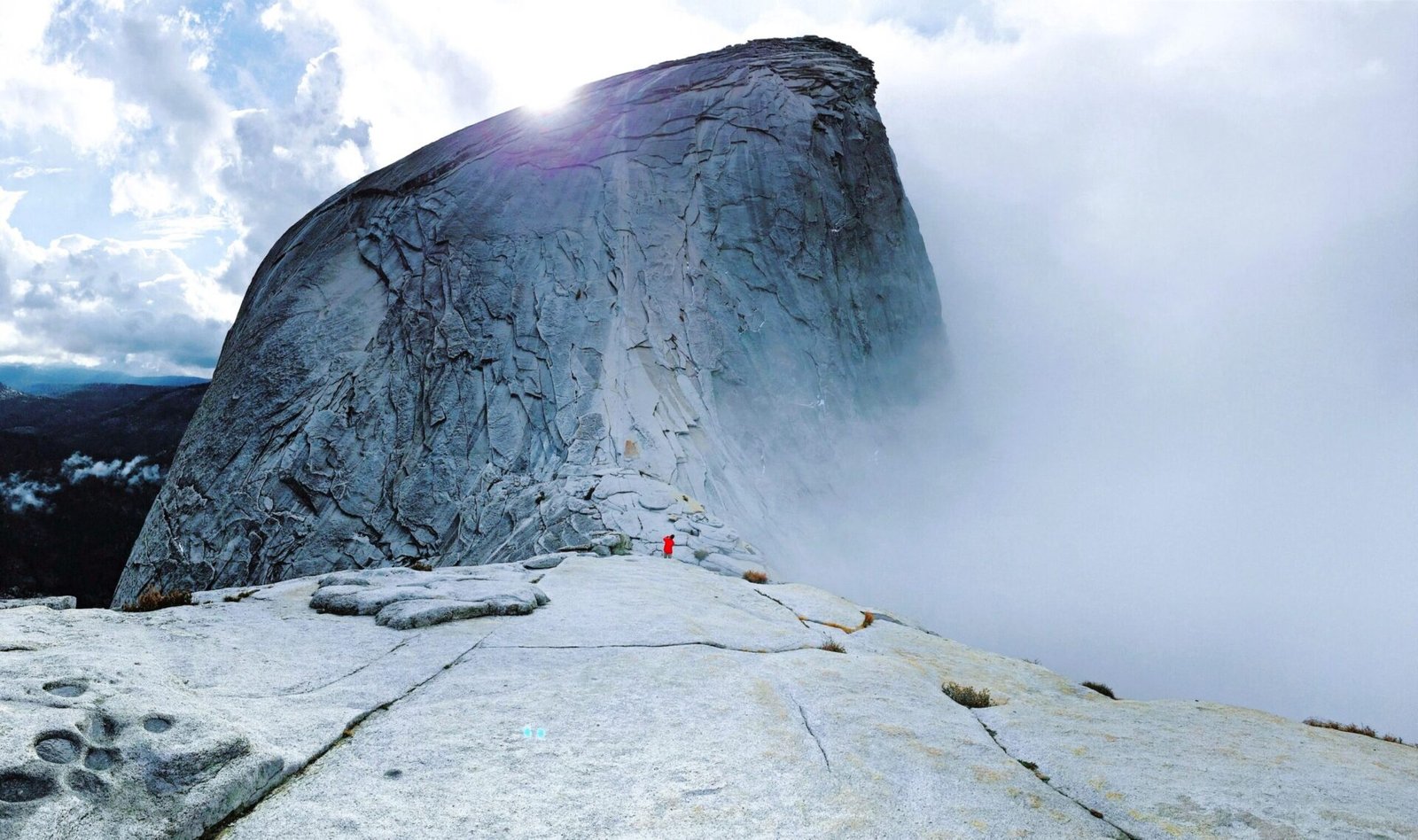 Half Dome is one of the most recognizable landmarks in Yosemite National Park , California. Rising nearly 5,000 feet above Yosemite Valley