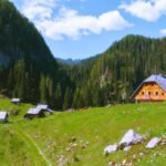 Koča na Planini pri Jezeru is a charming mountain hut located in the heart of the Julian Alps in Slovenia, at an altitude of 1,453 meters. Situated on a scenic alpine meadow near a small lake