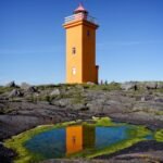 Stafnes Lighthouse is a hidden gem in Iceland that offers both charm and isolation. Painted in a striking color