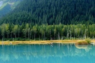 Blue Lake is a breathtaking retreat for nature lovers and adventure seekers alike. Its crystal-clear waters, surrounded by towering mountains and lush forests